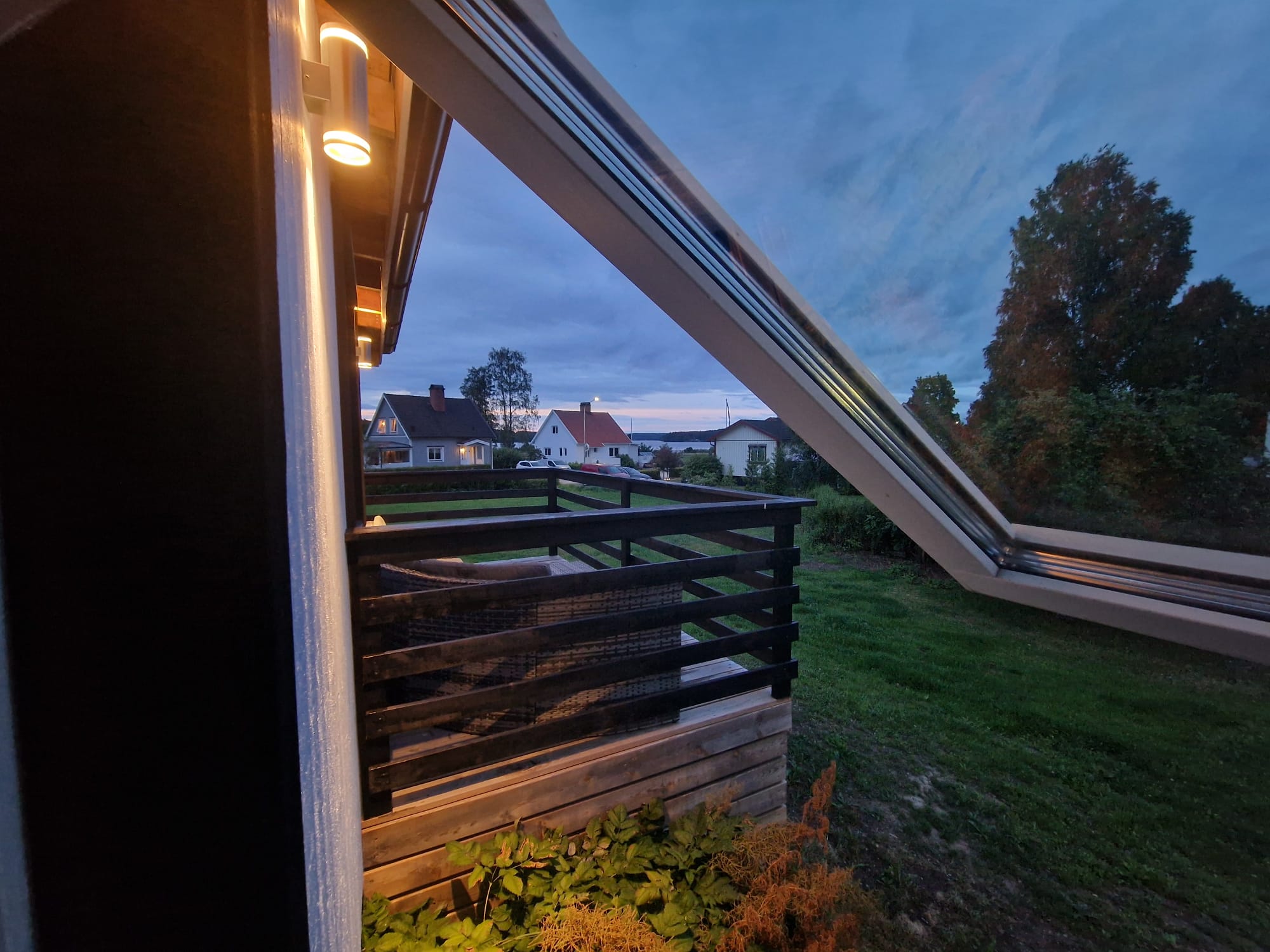 The neighbourhood and lake seen from the garden at dusk